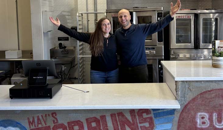 Velez and his wife, Kelsey, behind the counter at Mav’s Top Buns.