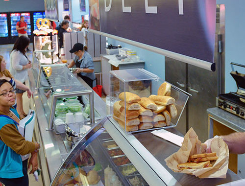 Jersey Blues Cafe, people at the counters order food. man serving them.