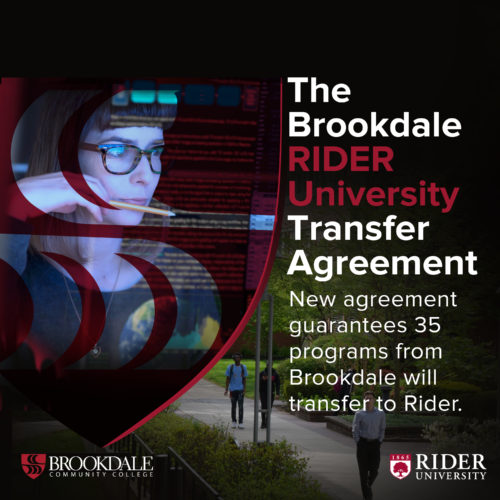 Man with headset on at computer. The Rider University Transefer Agreement