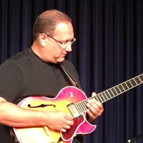 Jim Josselyn playing the guitar