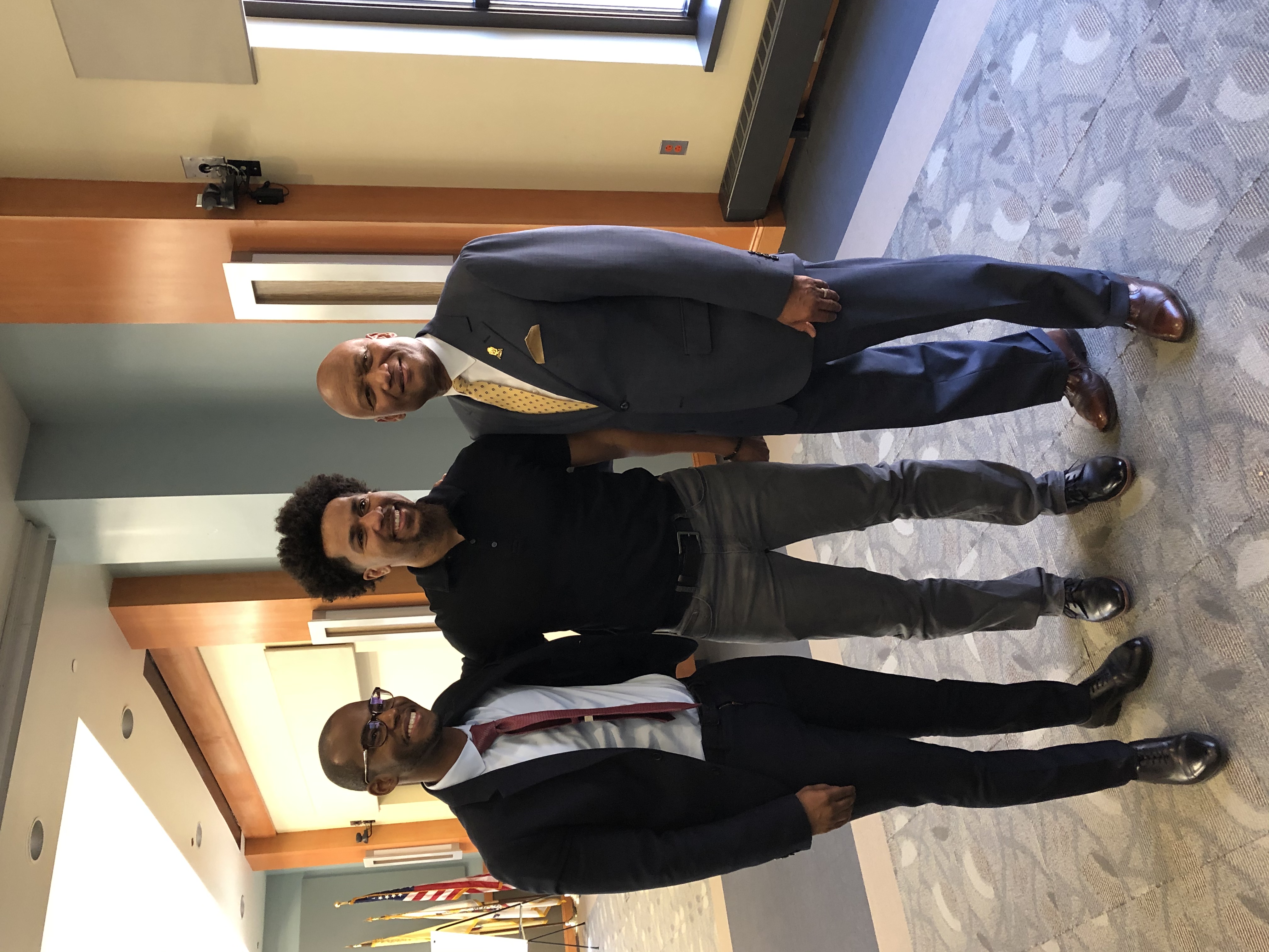 Kenneth D. Wilson alongside Fidel Wilson and another man.