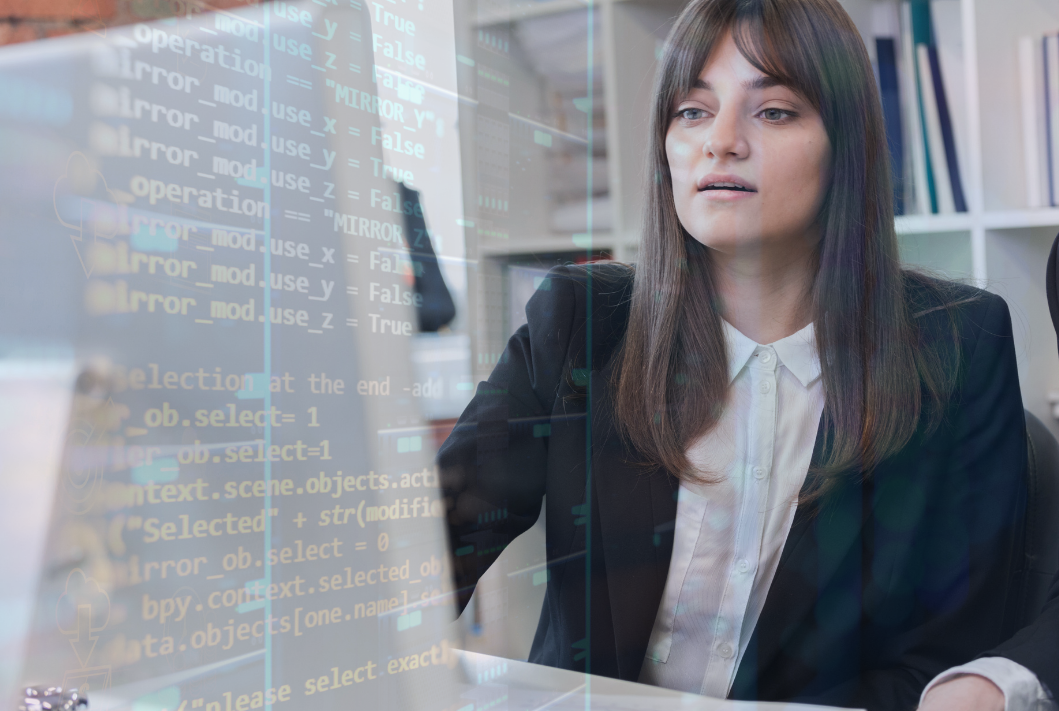 Woman at computer studying code