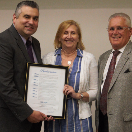 Dr Stout, Cynthia Gruskos, and Dr. Cram with proclamation for Cynthia.