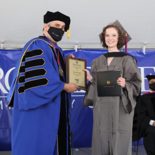 Susanna Falls receives award and diploma from President Dr. David Stout