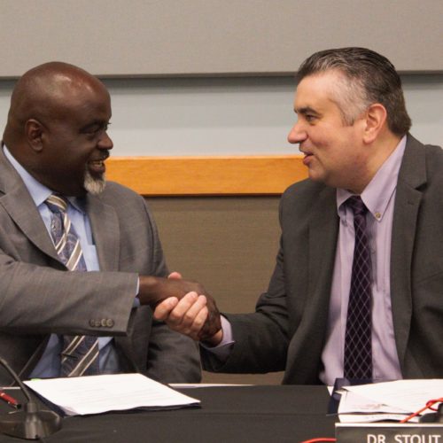 Dr. Charles Ford and Dr. David Stout Shake Hands on Agreement