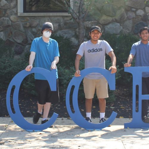 S-STEM students in front of the Success sign on campus.