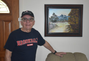 Picture of Edward Van Wicklen in a Brookdale t-shirt and hat.