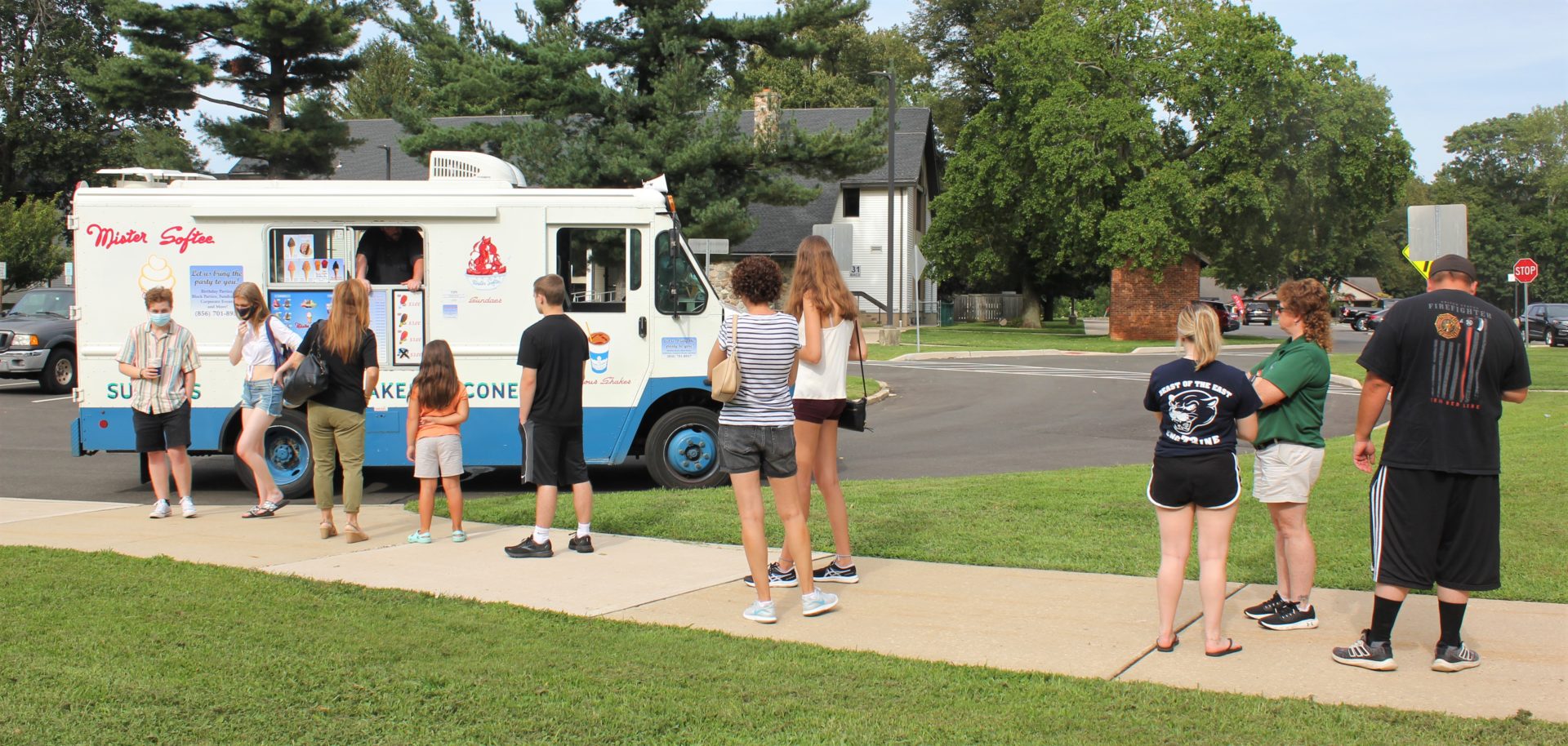Students on campus waiting for the ice cream truck.