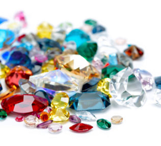 Pile of assorted colorful gems in different shapes and sizes