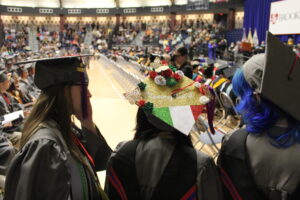 Decorated cap at commencement ceremony., says Mommy did it.