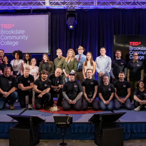 Men and women on the TEDx stage at Brookdale Community College.