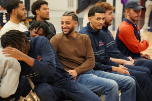 Teammates overjoyed in their seats at ring ceremony.