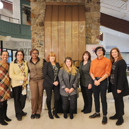 Eight men and women in the Wellness Center.