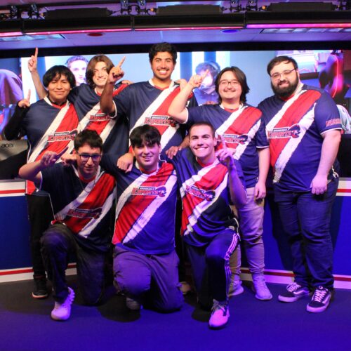 Eight guys with their number 1 fingers in the air as they smile after winning the championship.