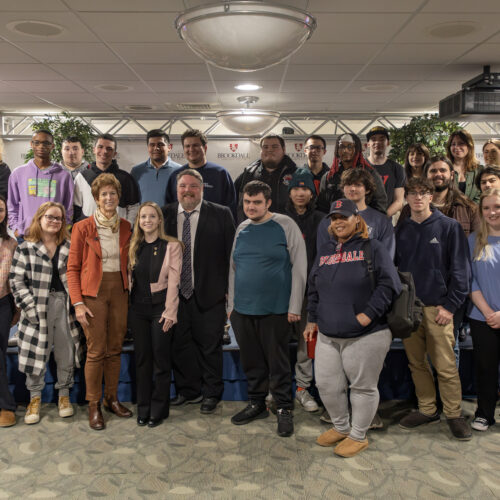 A group of students poising with former Governor Christine Todd Whitman.