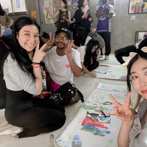 Brittany Scardigno Brookdale Community College Alum in Korea on a Fulbright. In the classroom coloring with her students.