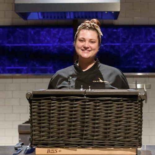 Arielle Brown on Chopped with her basket of goods in front of her.