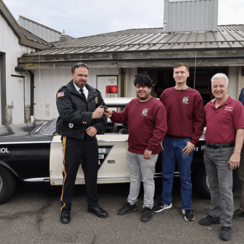 Five men handing the Keys over Union Beach Patrol Car restoration