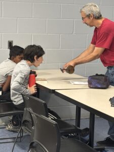 Scouting Auto Tech with surprise face on scout