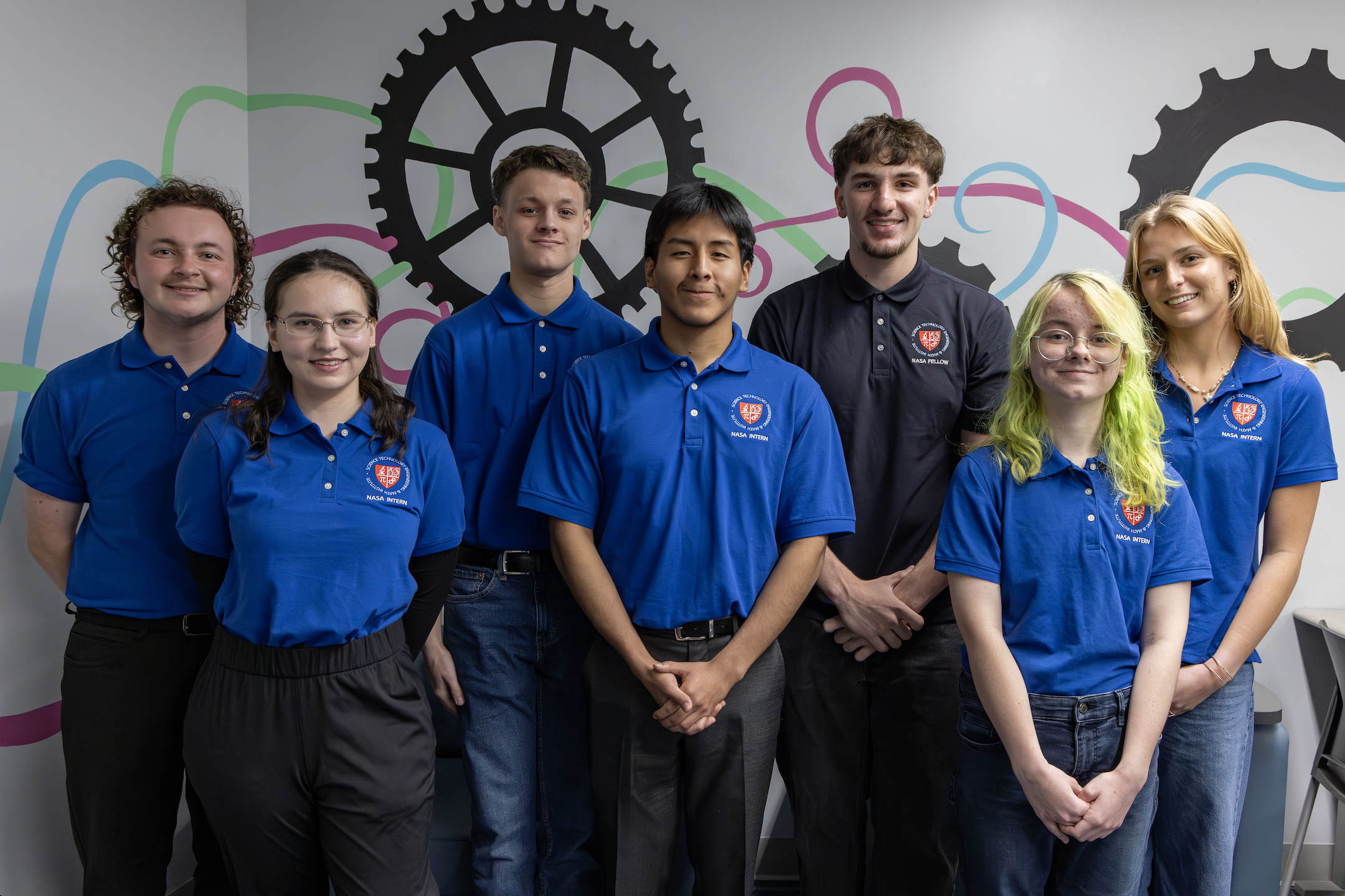 Brookdale Community College STEM NASA Interns 2025. Seven men and women wearing blue shirts