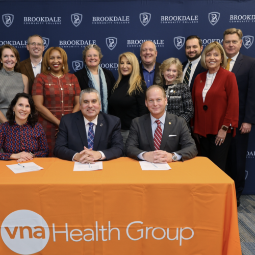 Board of Trustees from VNA and Brookdale come together for signing of agreement