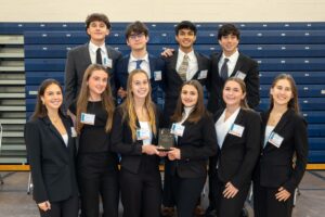 Group of students holding the 3rd place trophy