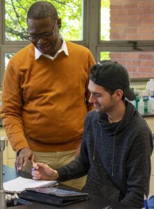 Dr. Devon Stewart helps a City College student with a question about a chemistry equation. (Denzell Washington/denzell.express@gmail.com)