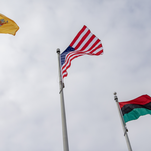 Pan-African Flag flying with American and Monmouth County flags