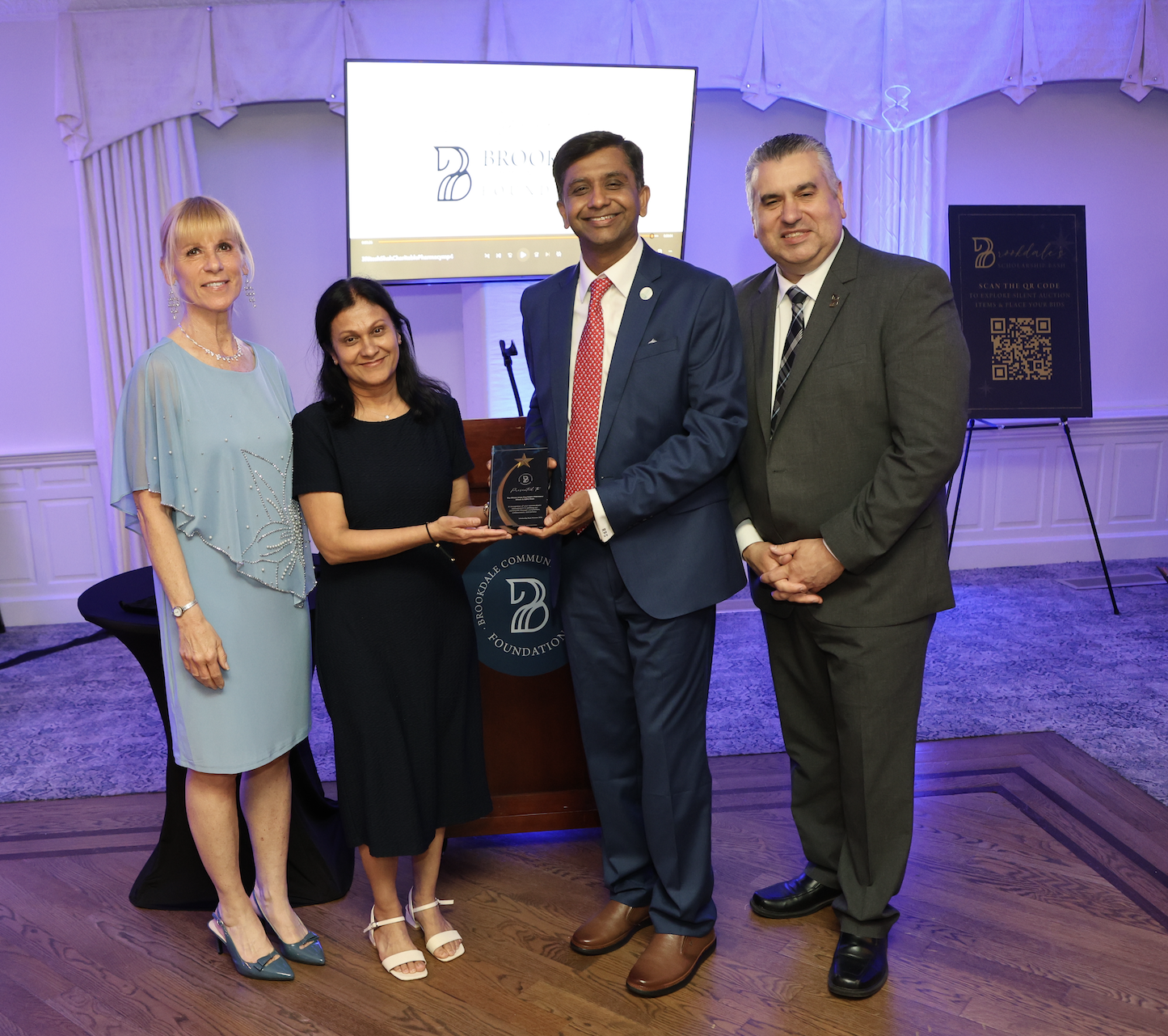 VP Nancy Kaari, Ritesh and Asha Shah, President Dr. David Stout