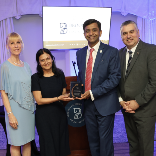 VP Nancy Kaari, Ritesh and Asha Shah, President Dr. David Stout