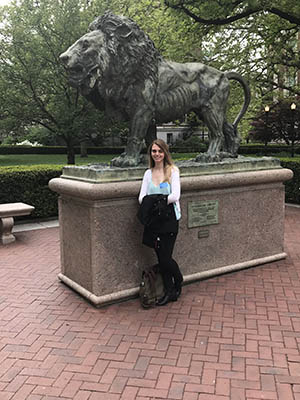 Victoria Cattelona stands in front of Columbia’s mascot, Roar-ee the Lion, on the Morningside campus.